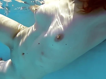 Curly-haired nubile with lead to sneakily and baps swims like a professional in be passed on pool, gets moist and ultra-kinky!